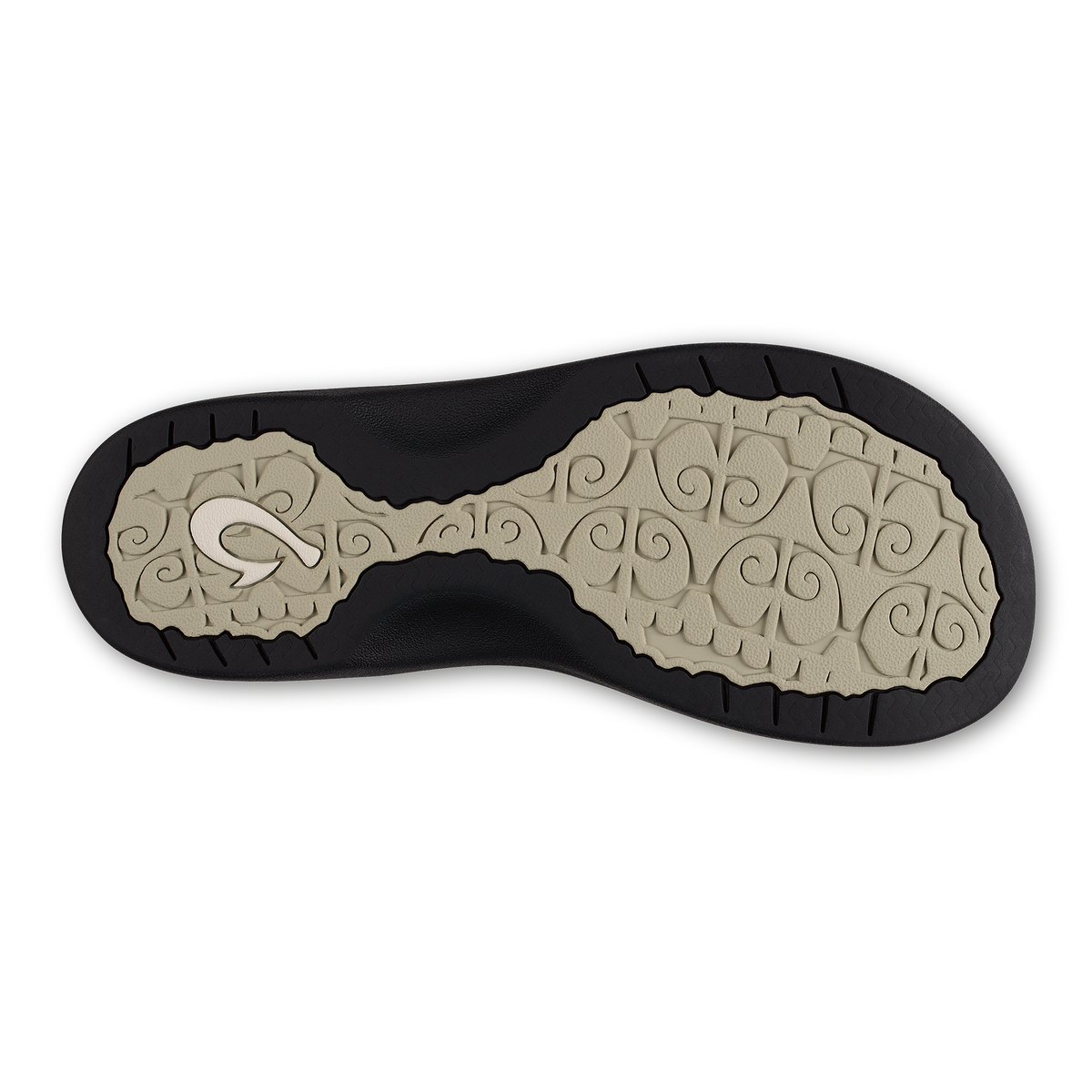 Shoe sole with ecru patterned footbed and black rubber outsole with tread.