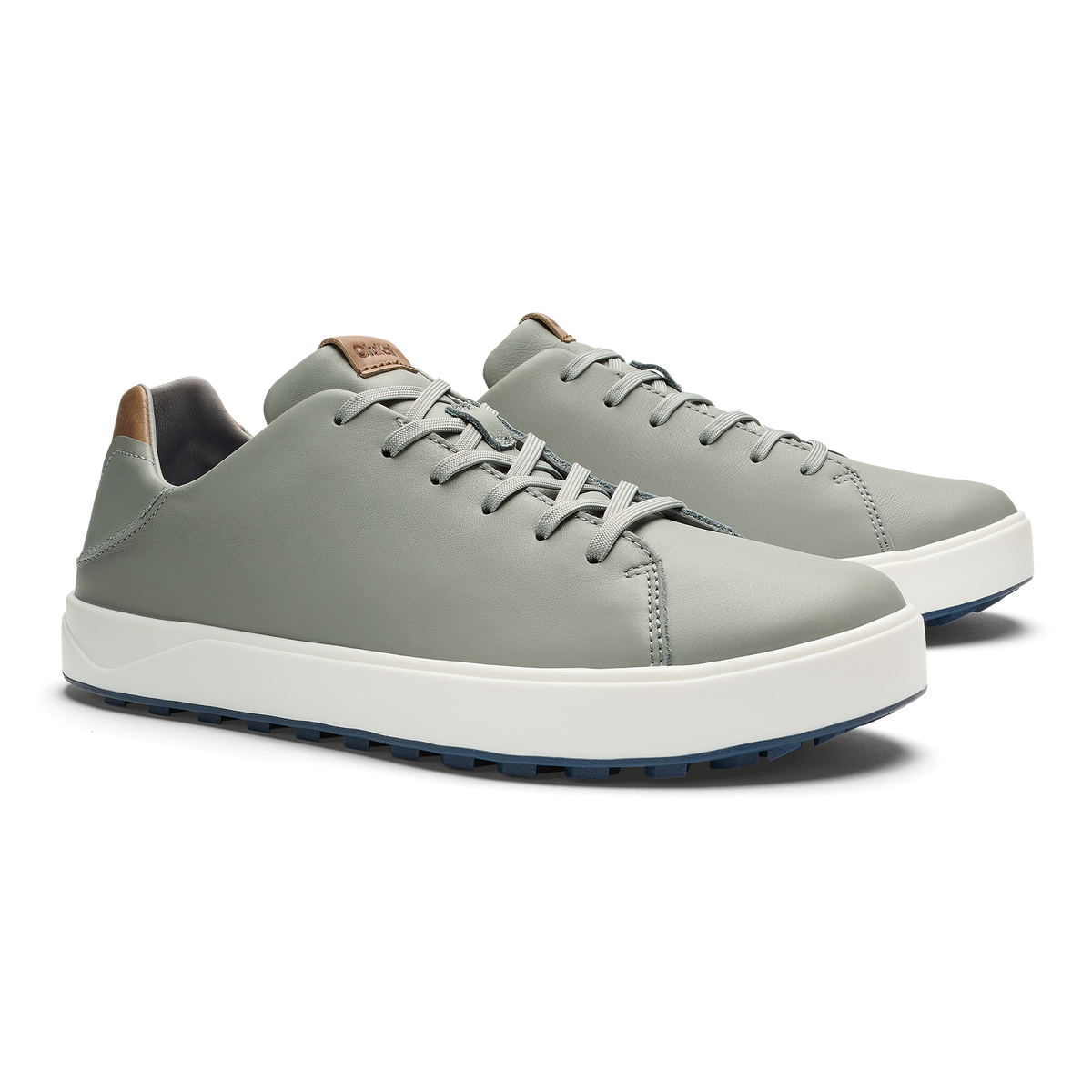 Grey lace-up sneaker with white platform sole and tan heel patch, shown from side angle.