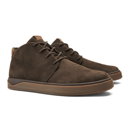 Pair of dark brown suede chukka boots with tan rubber soles and lace-up closure.