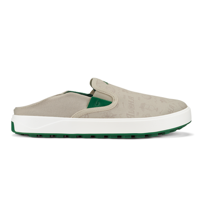 Beige canvas slip-on shoe with white midsole, green heel accent, and green rubber sole.