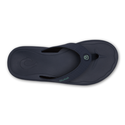 Dark blue thong sandal with textured upper, adjustable strap, and cushioned footbed shown from above.