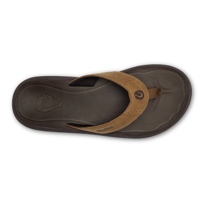 Tan leather thong sandal with dark brown rubber sole and perforated strap detail, viewed from above.