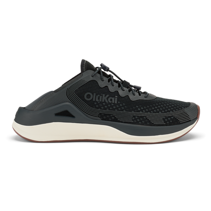 Black OldKai running shoe with white midsole and textured upper, shown in profile view.