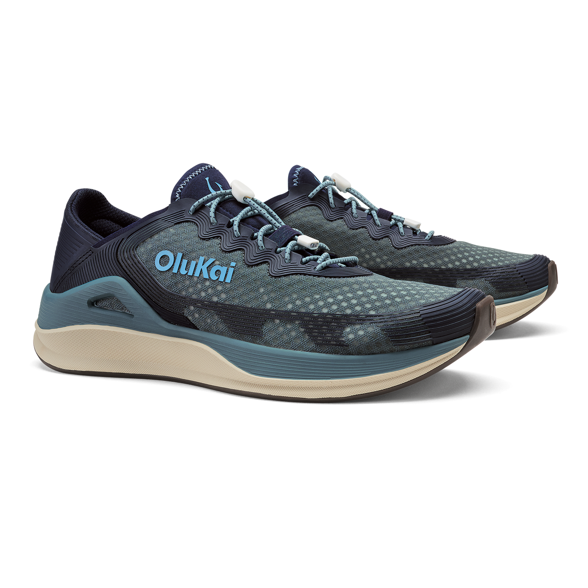 OluKai ʻAhi running shoe in storm blue and trench blue with light blue accents and cream sole.