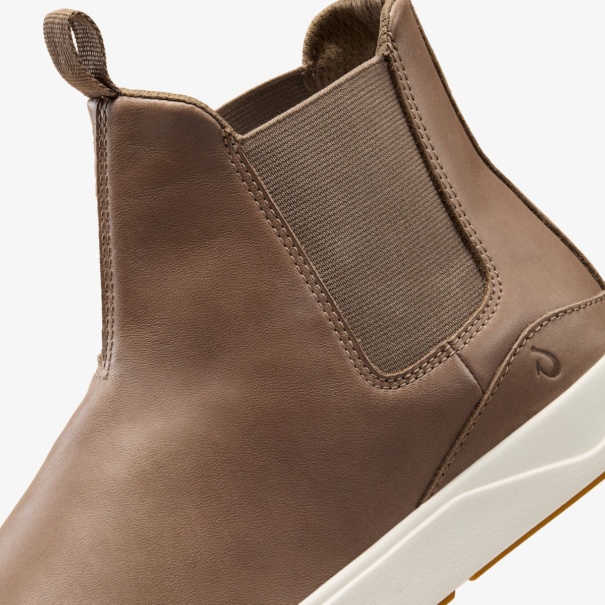 Tan leather Chelsea boot with elastic side panels, fabric pull tab, and white rubber sole.