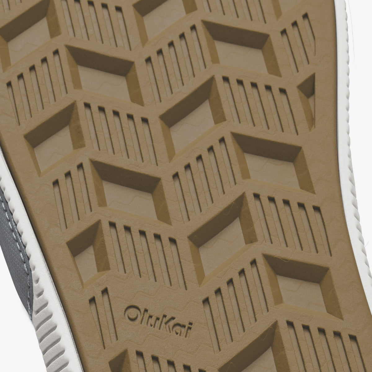 Tan slide sole with geometric tread pattern and OftaKat branding.
