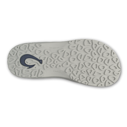 Light grey sole with dark blue logo and geometric tread pattern.