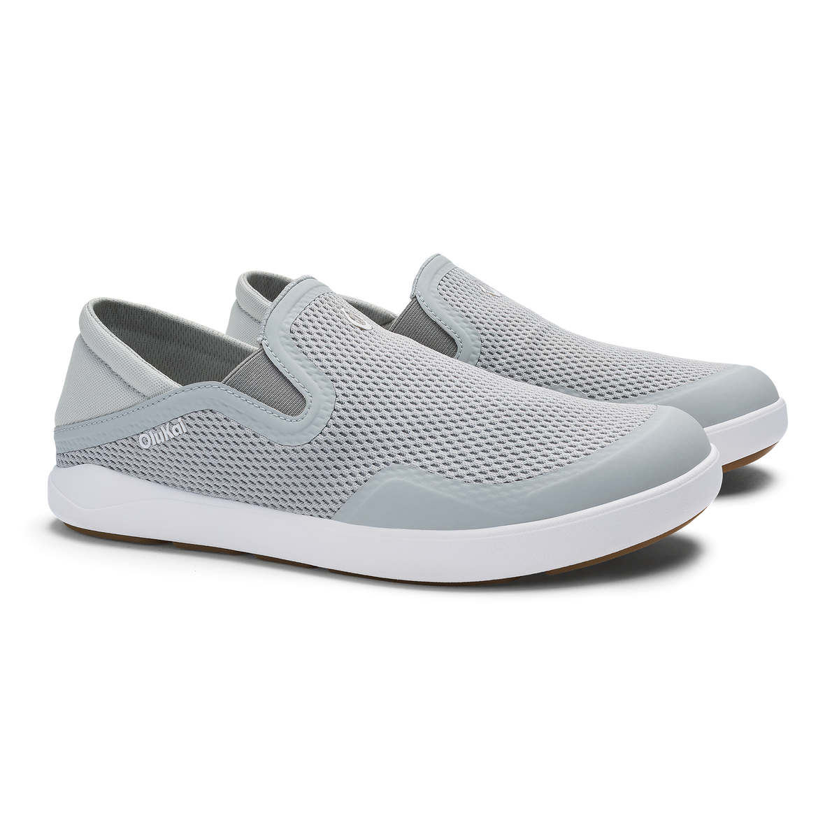 Pair of grey and white slip-on shoes with mesh upper and white sole, shown from a three-quarter view.