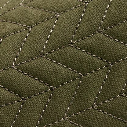 Olive green quilted fabric with cream-colored stitched diamond pattern detail.