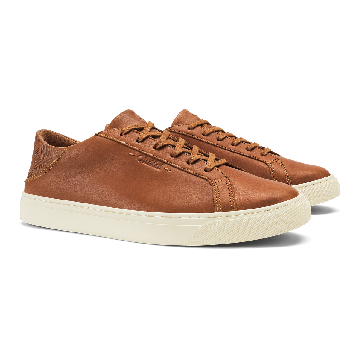 Tan leather lace-up sneaker with cream rubber sole and geometric heel detail.