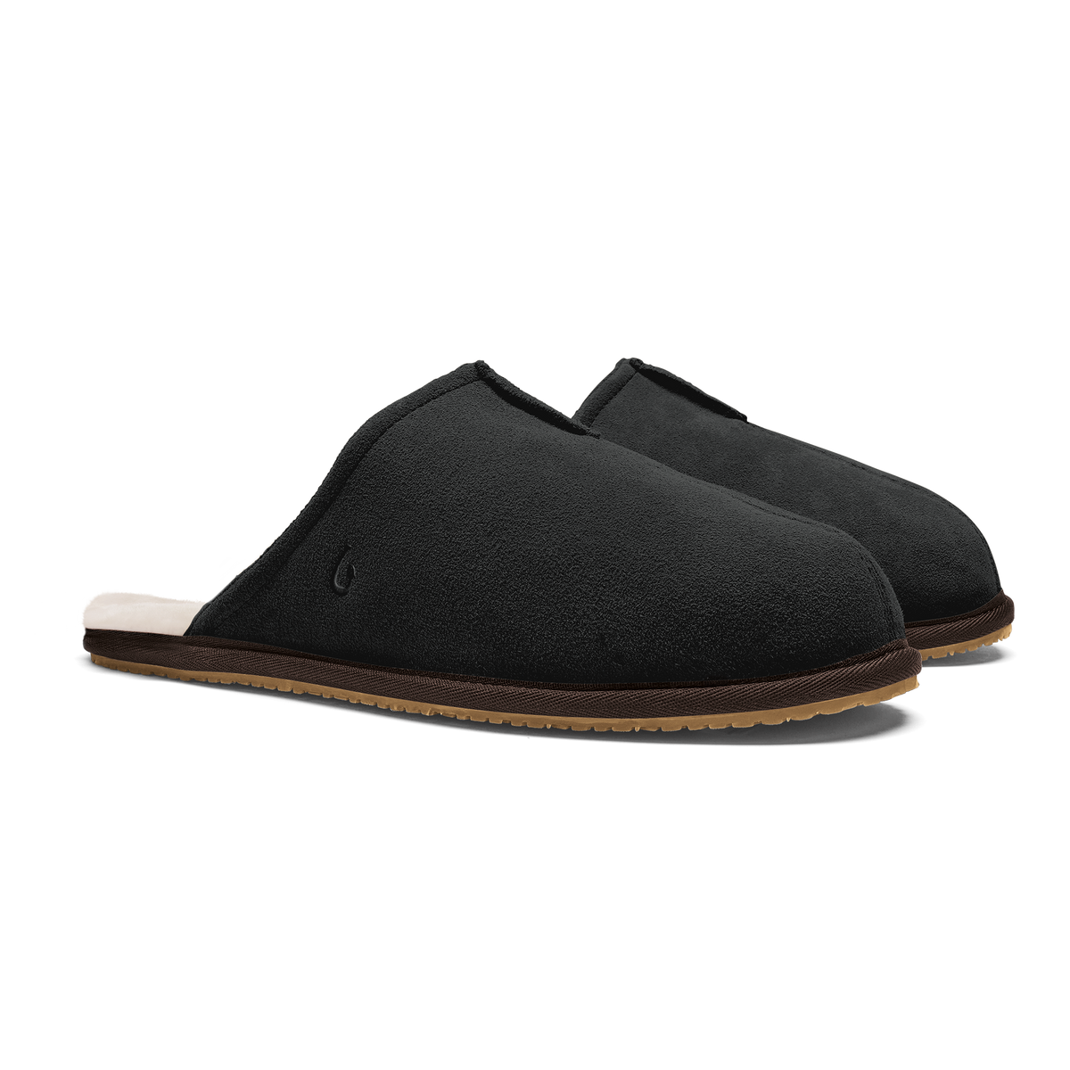 Black suede slippers with tan sole and cream fleece lining, shown from the side.