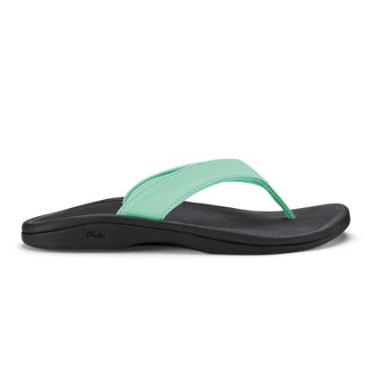 Black and mint green flip-flop sandal with curved sole and padded footbed.