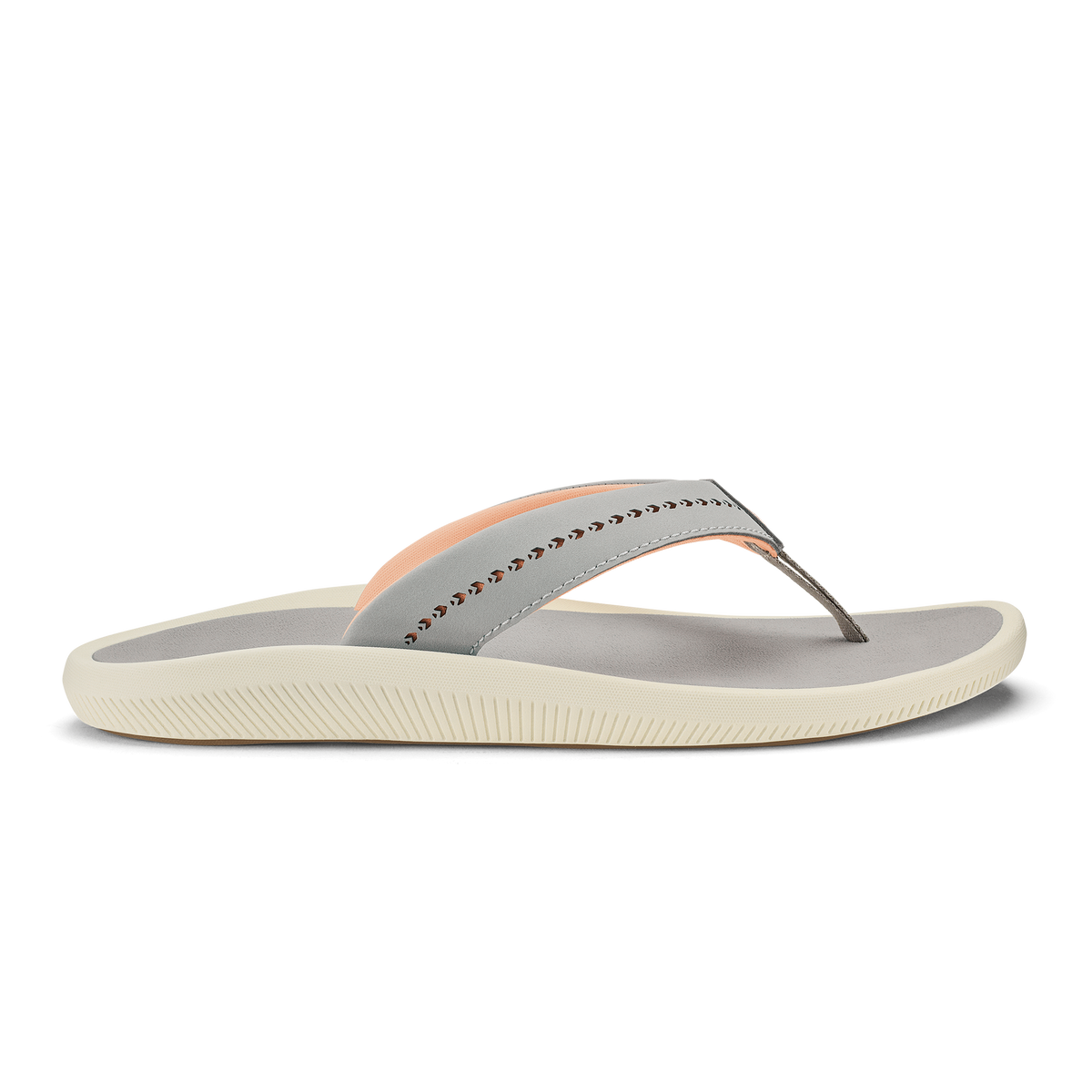 Ash-colored thong sandal with peach accent stripe, studded strap detail, and cream-colored ridged sole.