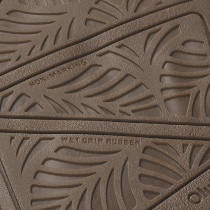 Tan rubber sole with embossed leaf pattern and "Wet Grip Rubber" text visible.