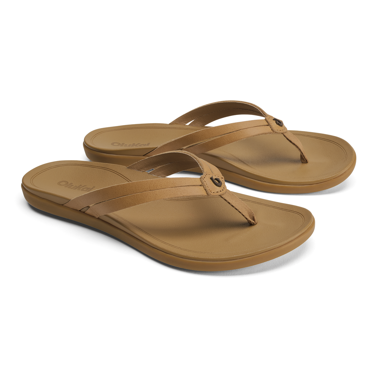 Pair of tan leather thong sandals with cushioned soles and adjustable straps.
