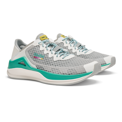 Grey and white running shoe with bright white laces, teal heel accents, and textured mesh upper displayed from the side angle